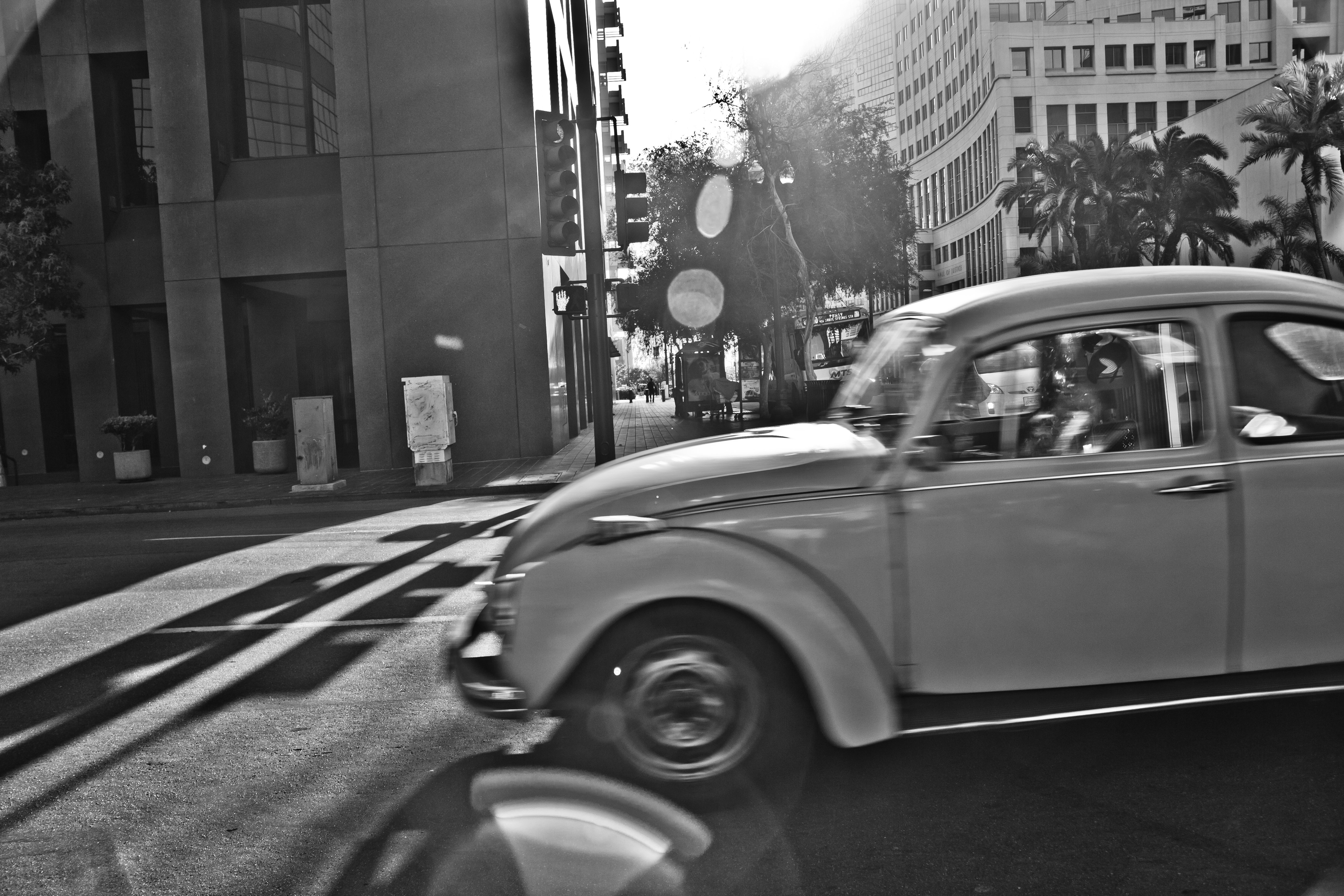 grayscale photo of car on road